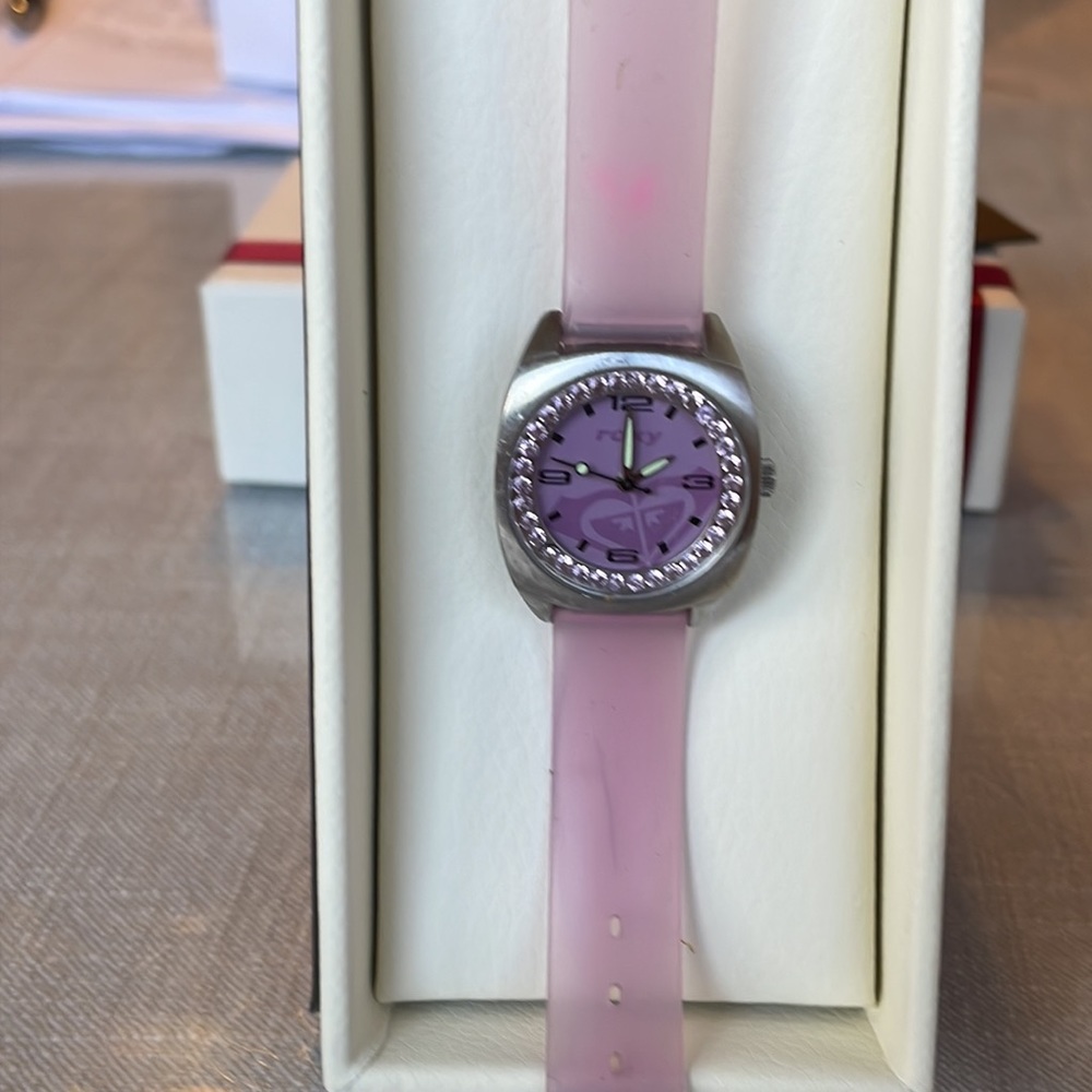 Roxy ladies pink watch/silicone band.Water resistant 100 meters stainless steel